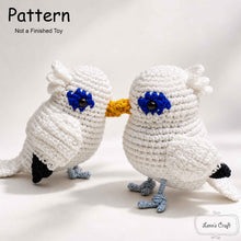 Cargar imagen en el visor de la galería, Bali Myna amigurumi crochet bird doll pattern with white body, blue eye patches and yellow beak