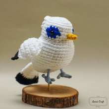 Cargar imagen en el visor de la galería, Handmade Bali Starling amigurumi crochet bird with blue eye patches
